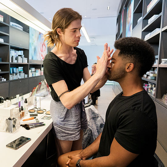Pro Makeup Artist Applying Makeup on Male Client